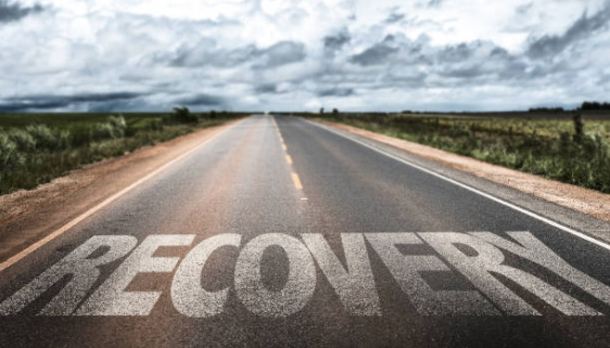 a road with the word recovery painted on it